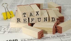 Tax refund written on wooden markers